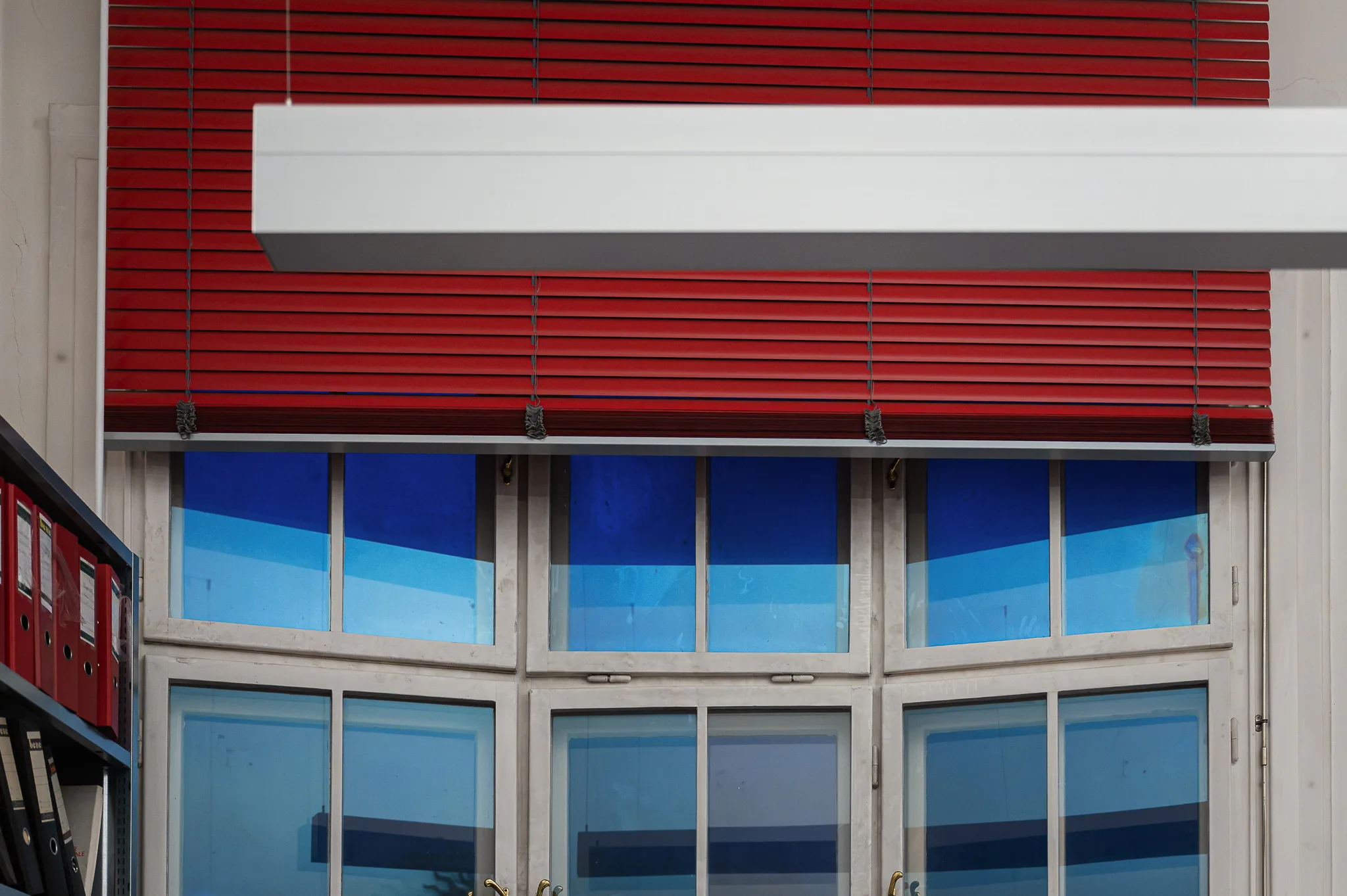 Red blinds and blue windows in the reading room, Bruno Kreisky Archive, Vienna, 2026