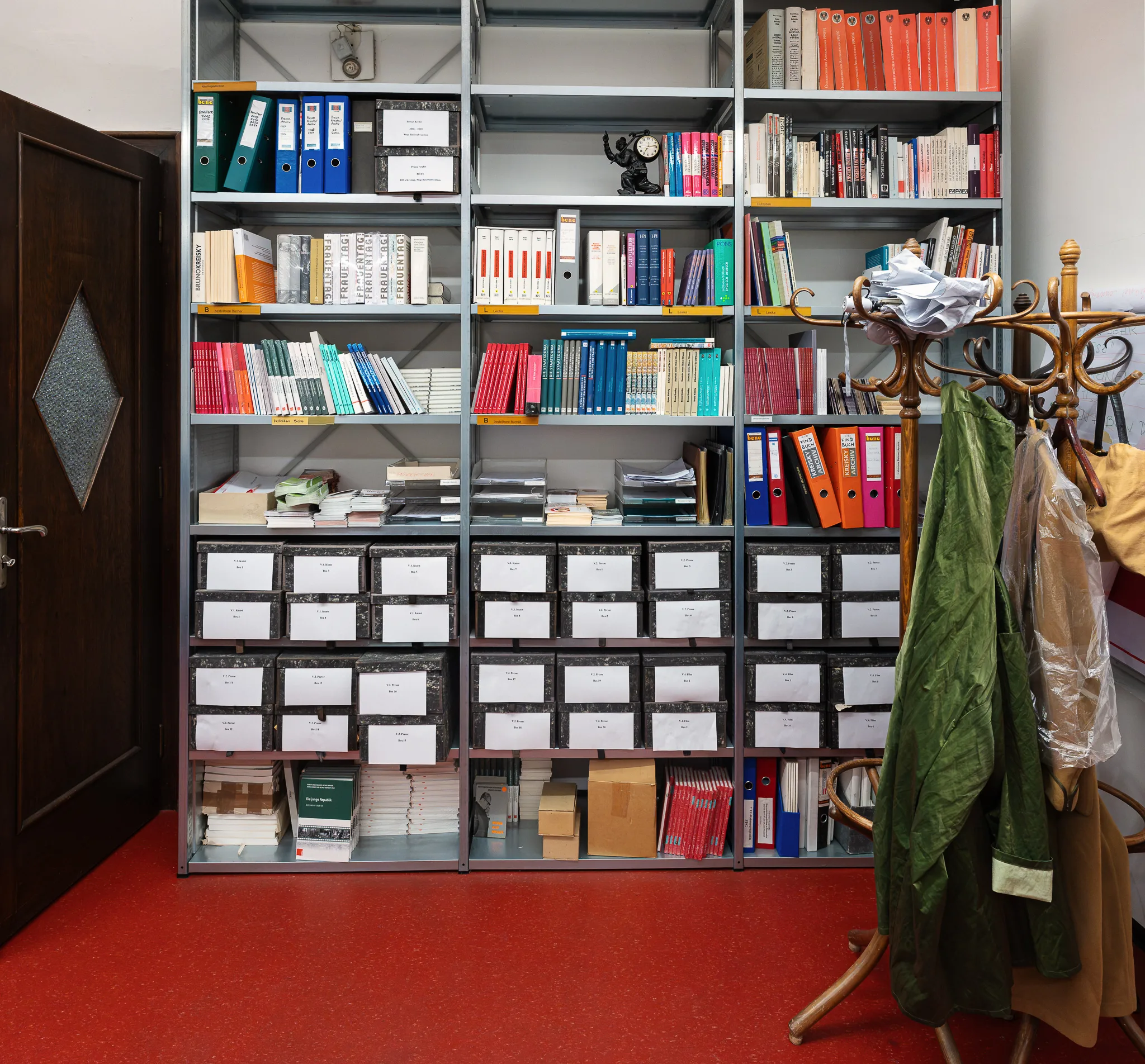 Shelves of files and a coat stand, Bruno Kreisky Archive, Vienna, 2026